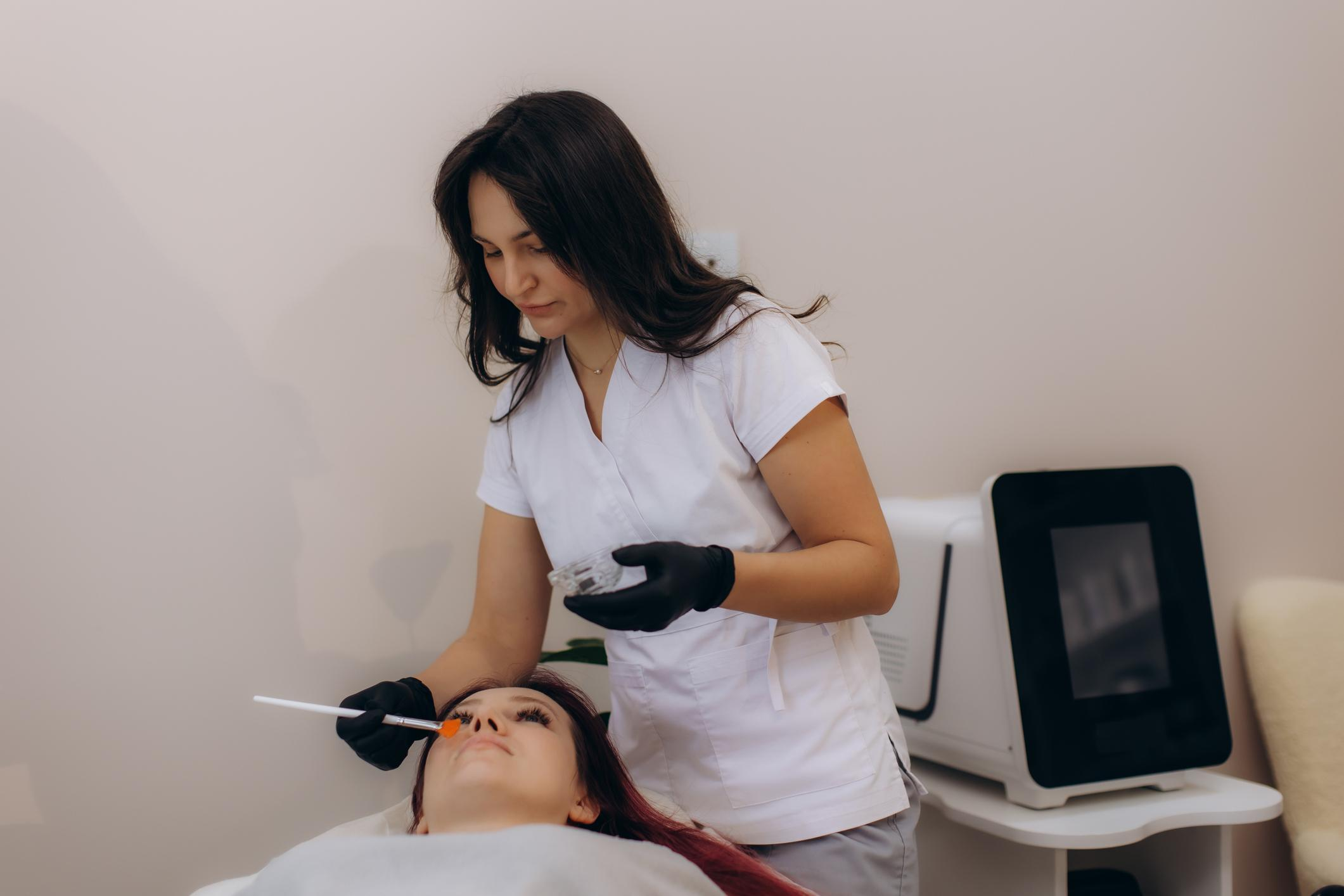 Hera Wellness Studio expert treatment specialist performing facial skin care